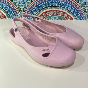Crocs Pink Flats with rhinestone on ankle strap. Woman’s size 7